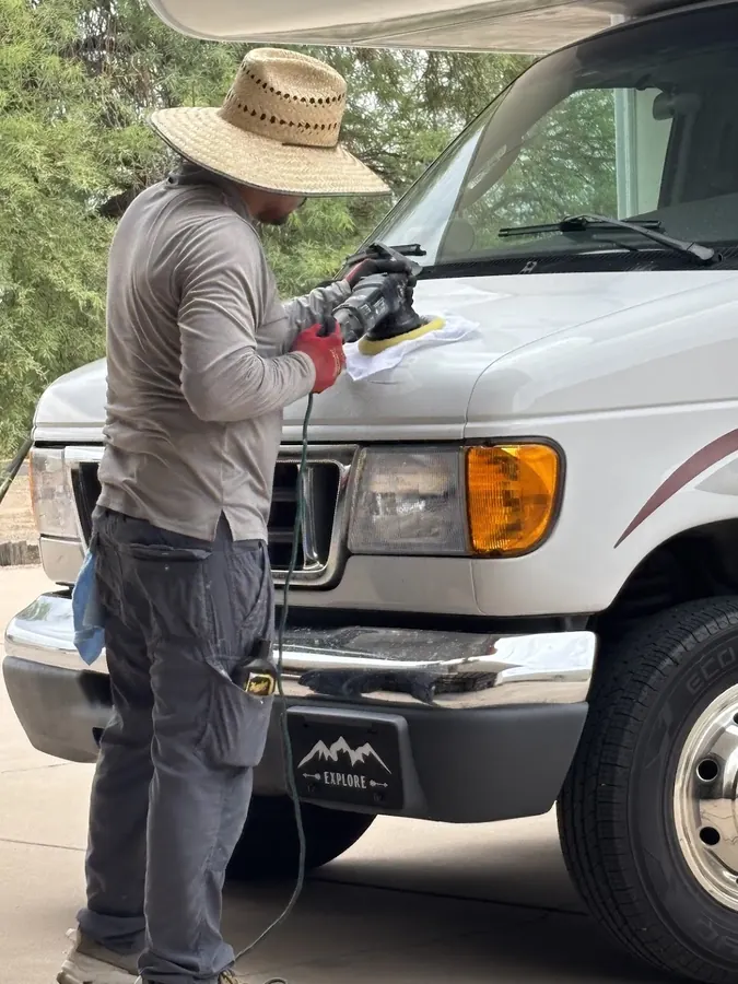 Power buffing the front cap of a Class C motorhome